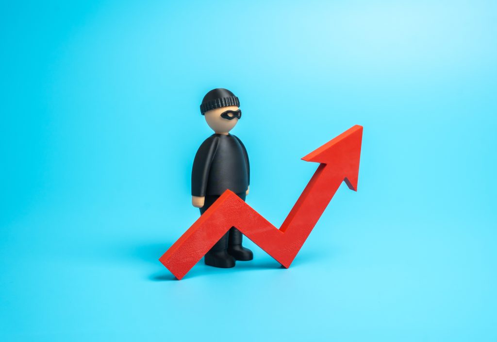 Masked thief figure beside a rising red arrow showing construction tool theft on the increase